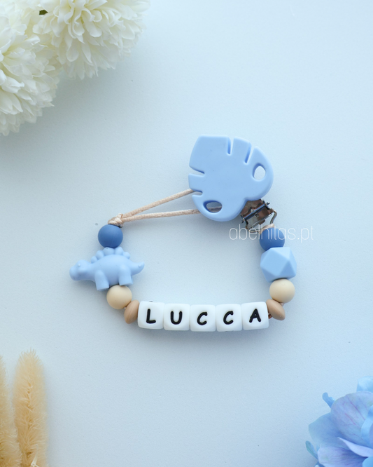 Prendedor de chupeta com nome - Dinossauro azul